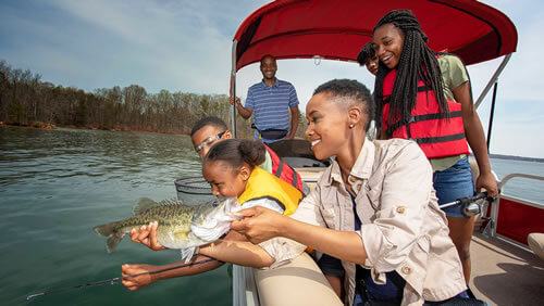Family fising from pontoon boat