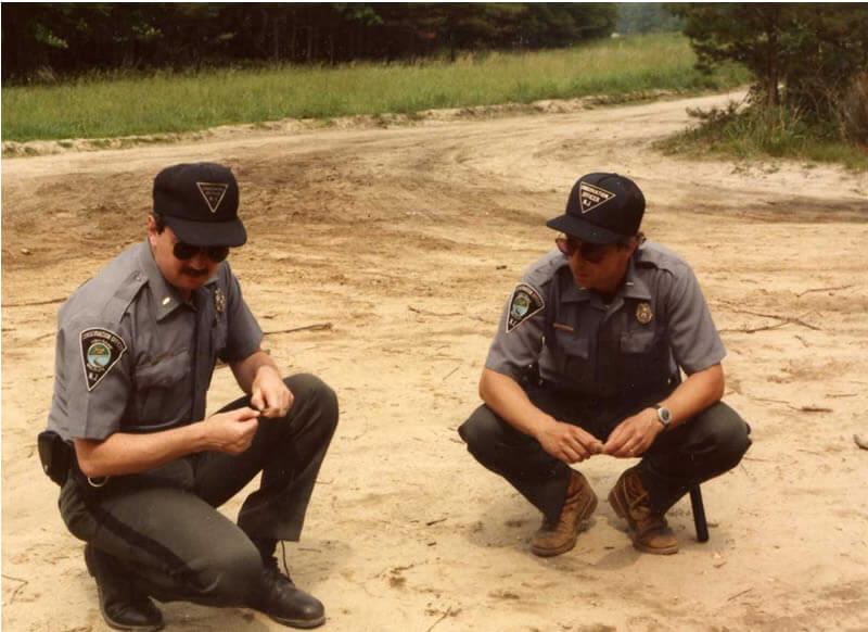 Officers inspect tire tracks