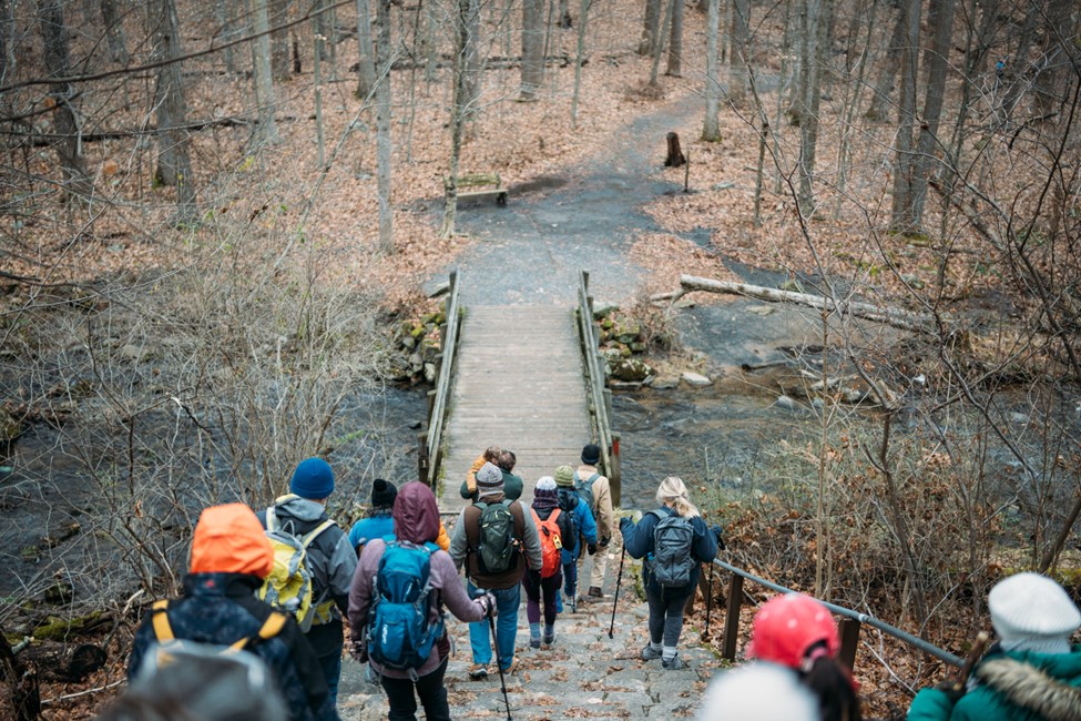 hikers-crossing-a-bridge