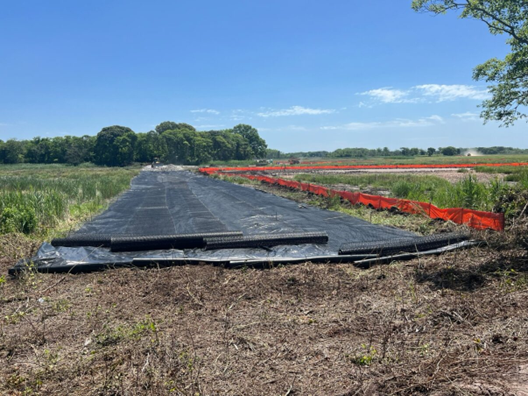 Picture27-june2024 Placement of fabric and geogrid before the construction of the northern berm foundation – June 2024